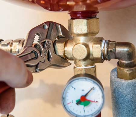 plumber taking water pressure